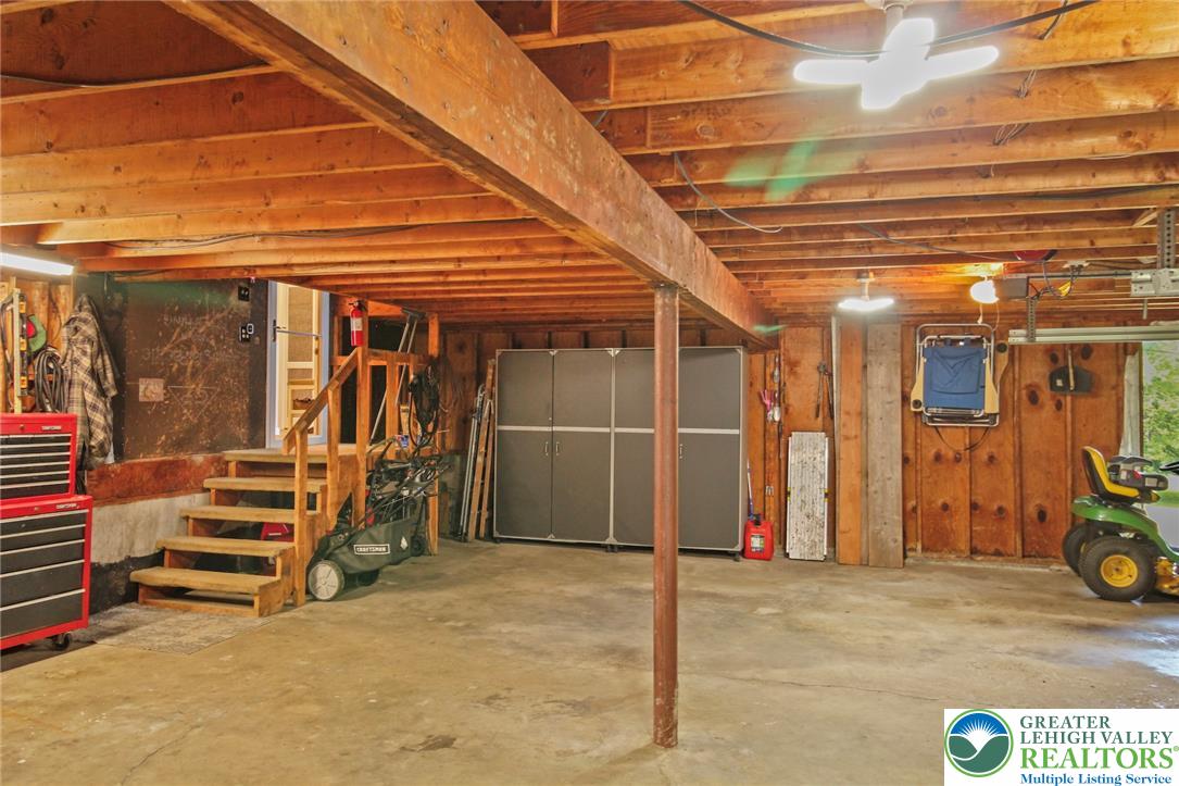 3470 Brodhead Road Bethlehem, PA 18020 - Photo 73 of 84 A well-maintained garage offering ample storage and utility space, with exposed wood beams and functional lighting.