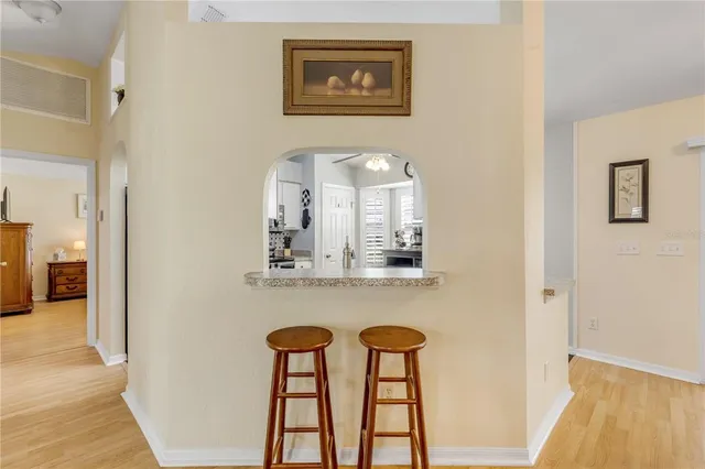 a bedroom with a bed and a lamp