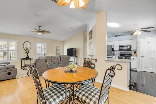 a view of a swimming pool with an outdoor seating and yard