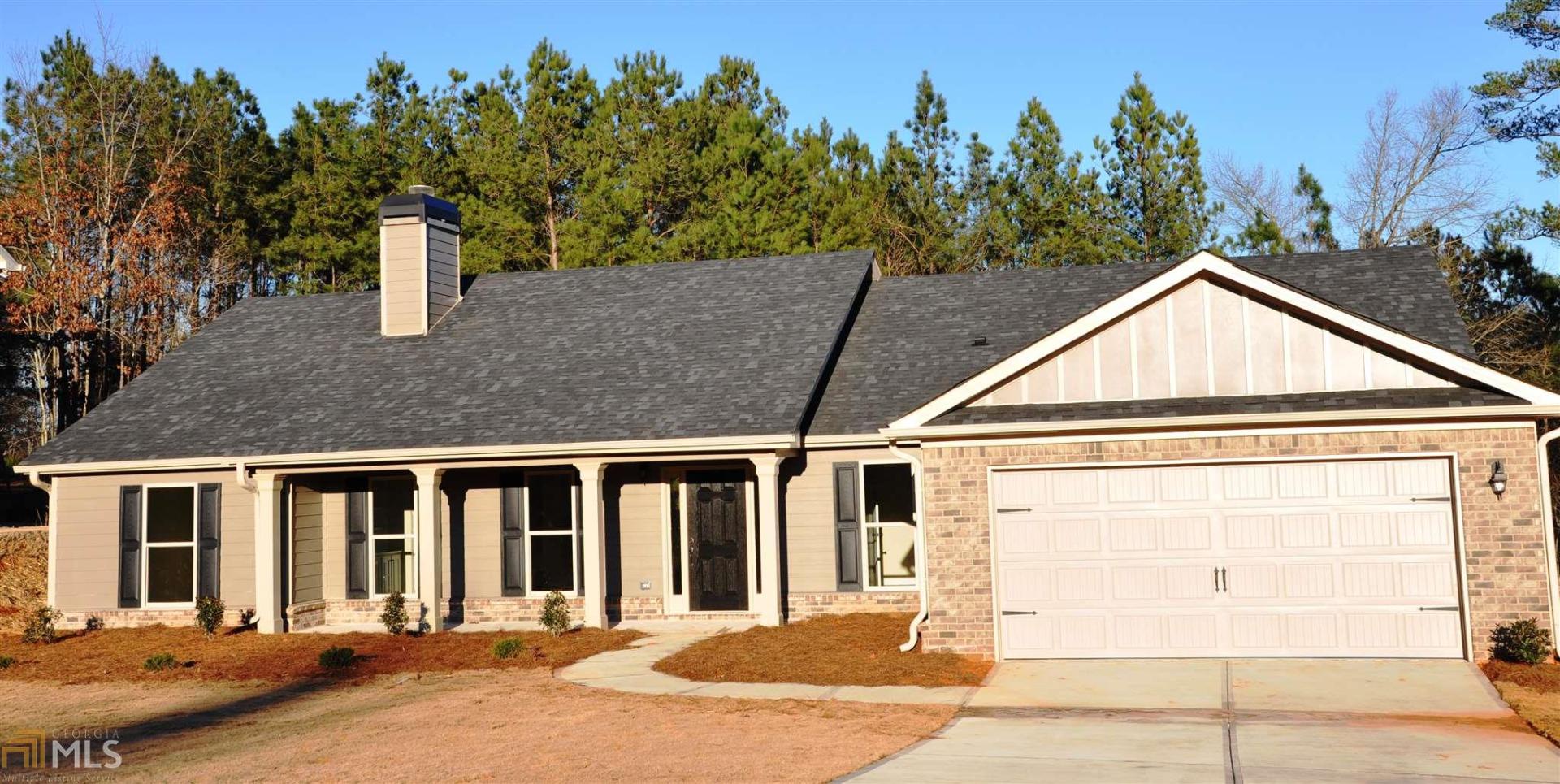 2482 Hollis Road, Unit 3 Statham, GA 30666 - Photo 1 of 1 a view of a house with a backyard