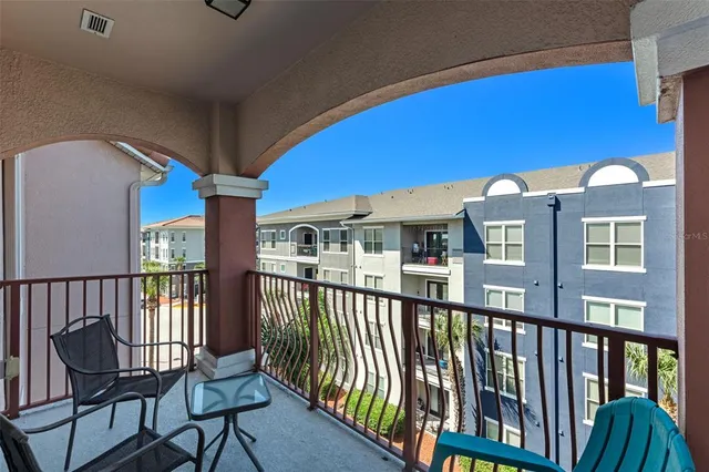 a view of a balcony with chairs
