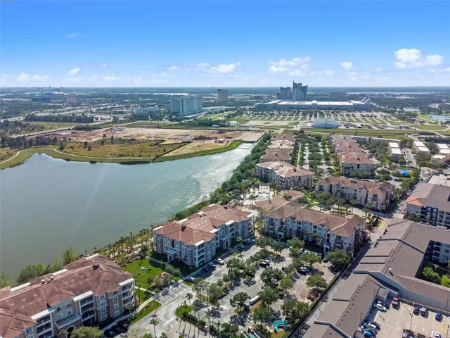 an aerial view of a city and lake view