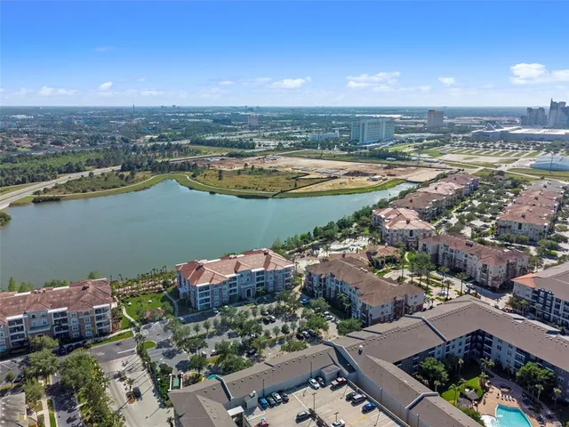 an aerial view of a city and lake view
