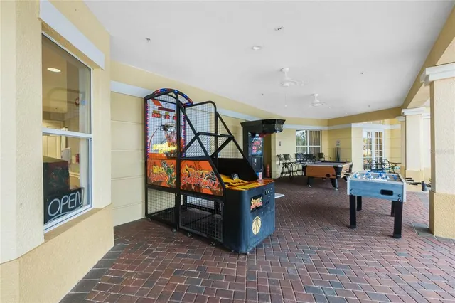 a living room with furniture a rug and white walls