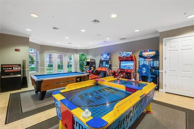 a room with furniture and pool table