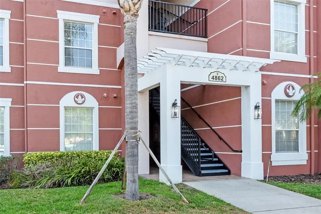 a front view of a building with glass windows and door