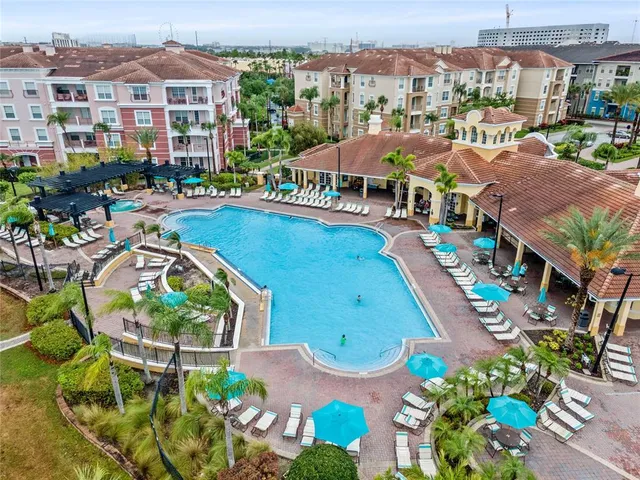 an aerial view of residential houses and outdoor space