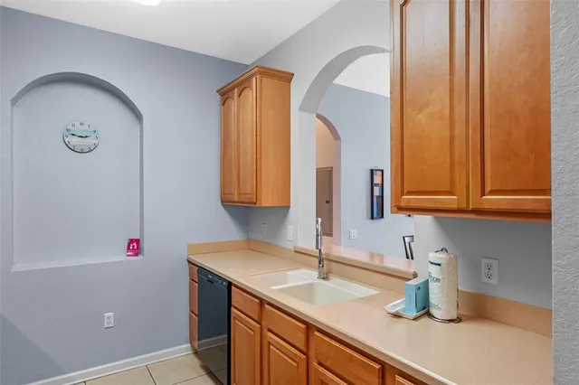 a kitchen with a sink and a window