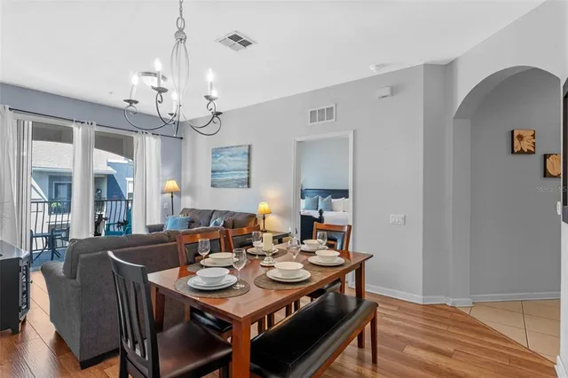 a view of a dining room with furniture and wooden floor