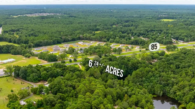 swimming pool view with a seating space