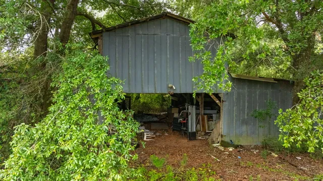 an aerial view of a residential apartment building with a yard