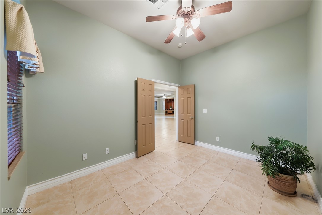 1104 Norellat Road Henderson, NV 89011 - Photo 23 of 52 Double doors open from this versatile space to reveal the main living areas.