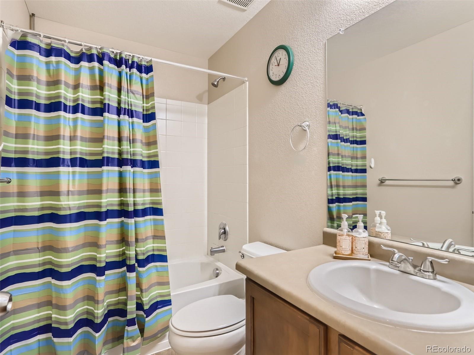 8080 Raspberry Drive Frederick, CO 80504 - Photo 16 of 29 a bathroom with a sink a toilet and shower