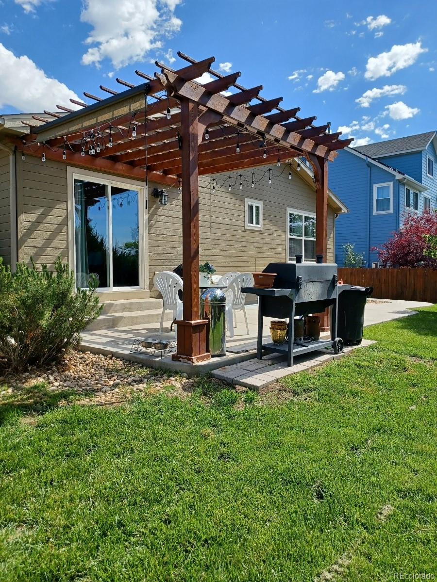 8080 Raspberry Drive Frederick, CO 80504 - Photo 24 of 29 a view of a house with backyard porch and sitting area