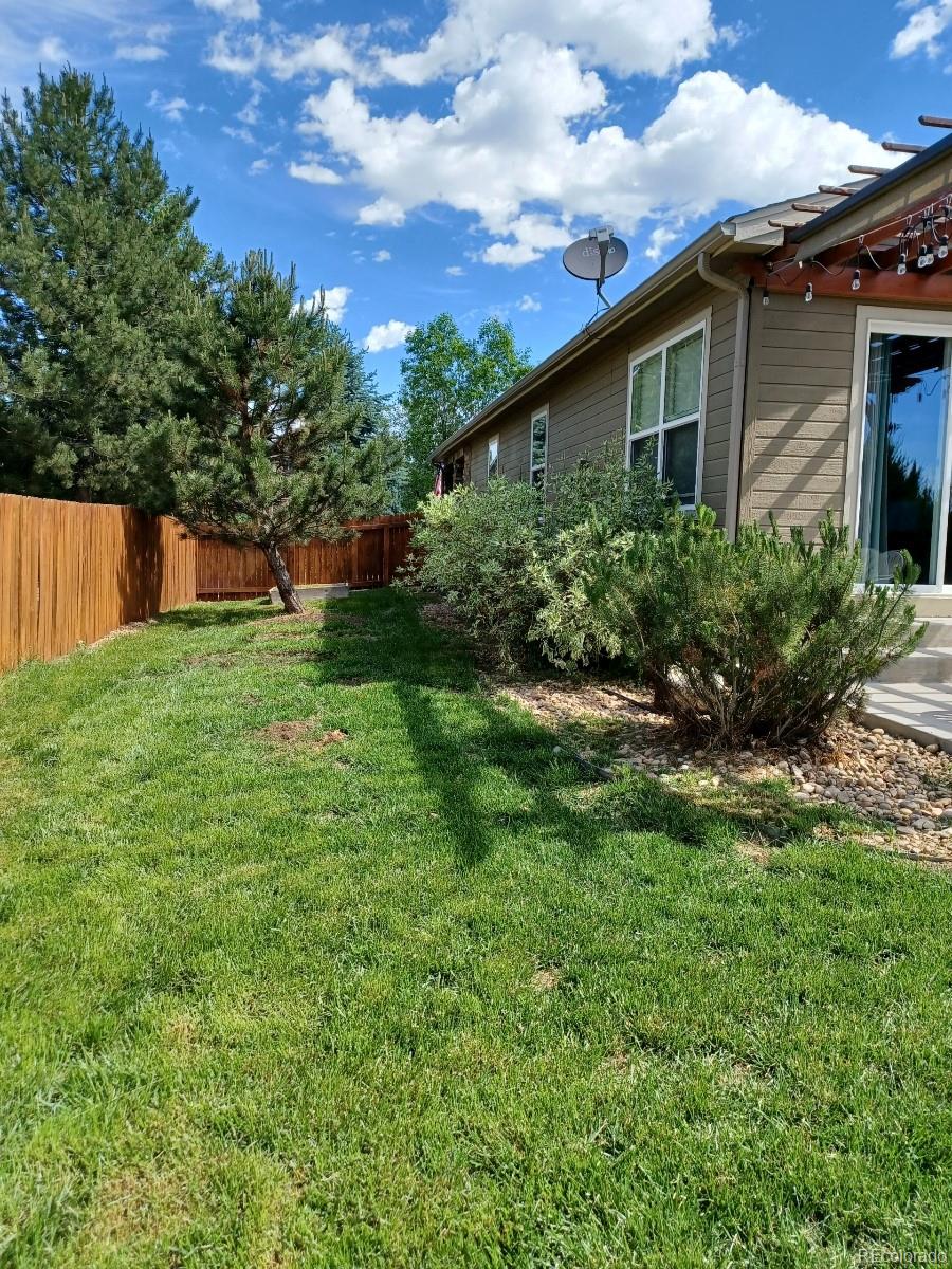8080 Raspberry Drive Frederick, CO 80504 - Photo 26 of 29 a view of a yard in front of house