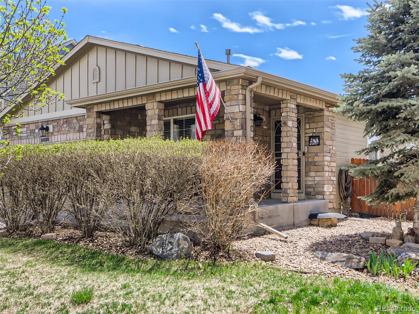 8080 Raspberry Drive Frederick, CO 80504 - Photo 29 of 29 a front view of a house with garden