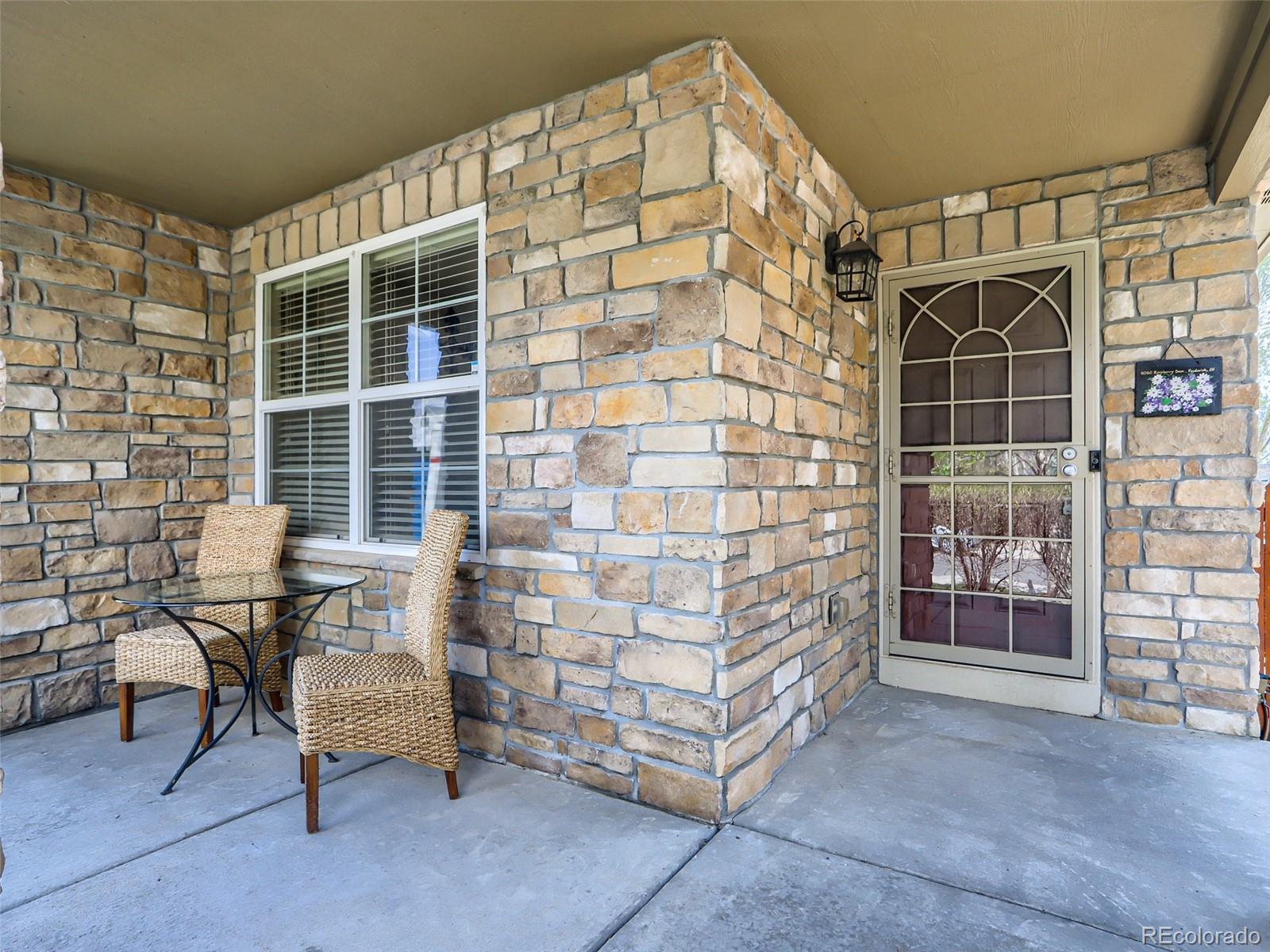 8080 Raspberry Drive Frederick, CO 80504 - Photo 3 of 29 a patio with table and chairs