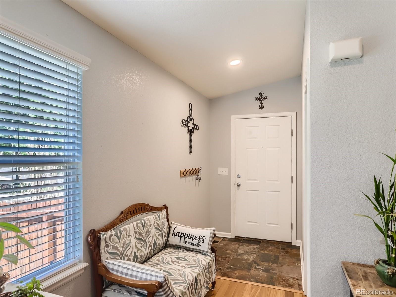 8080 Raspberry Drive Frederick, CO 80504 - Photo 4 of 29 a living room with furniture and a window