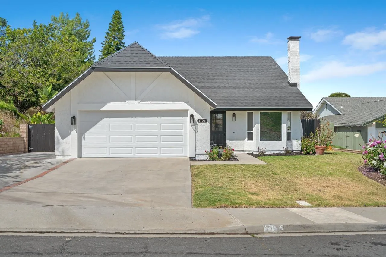 1706 Catalpa Road Carlsbad, CA 92011 - Photo 1 of 41 a front view of a house with garden