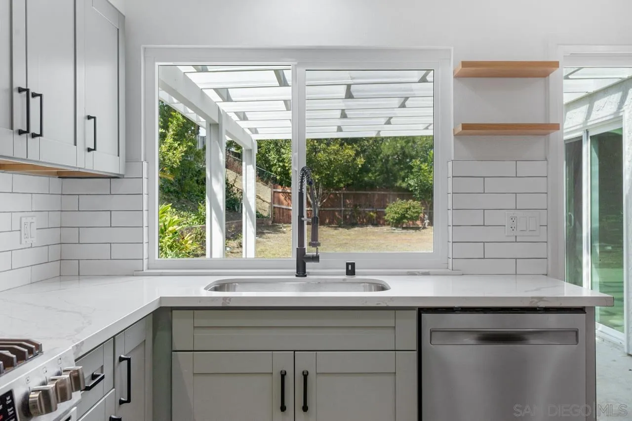 1706 Catalpa Road Carlsbad, CA 92011 - Photo 11 of 41 a sink and a window in a kitchen