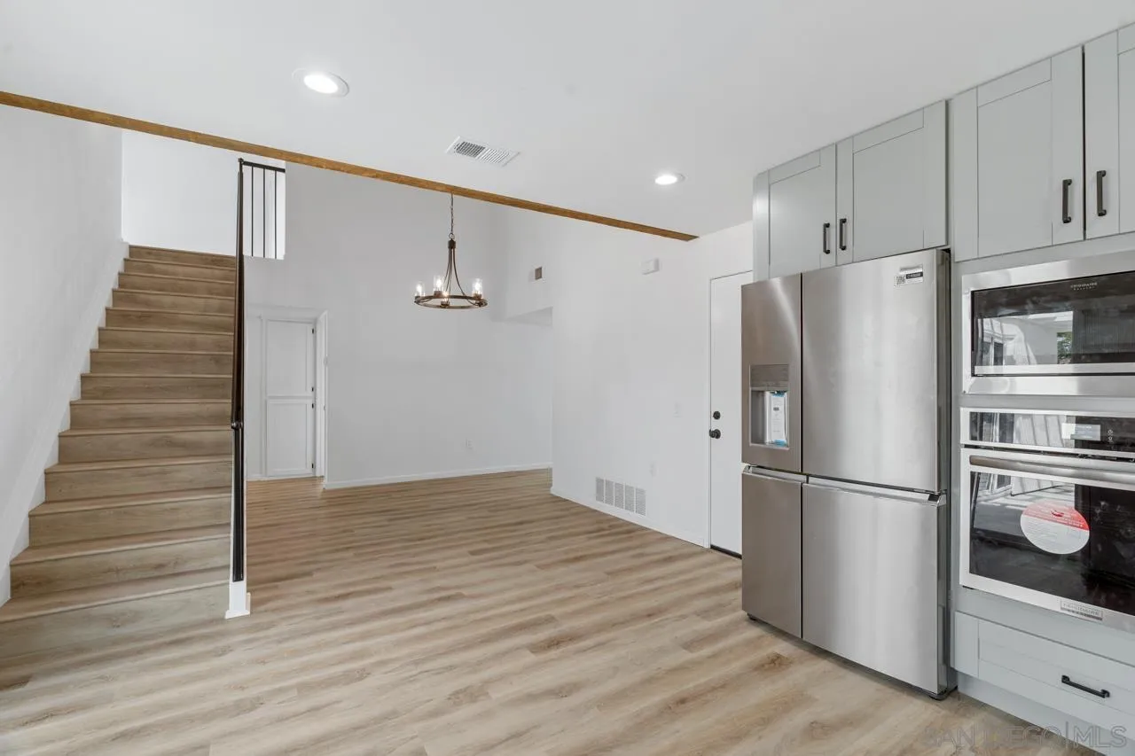 1706 Catalpa Road Carlsbad, CA 92011 - Photo 12 of 41 a view of kitchen with wooden floor and electronic appliances