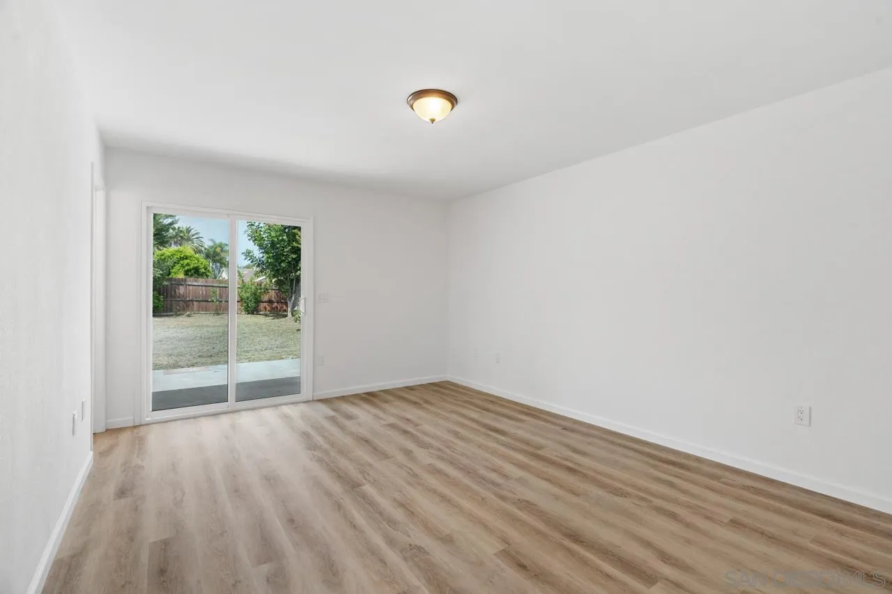 1706 Catalpa Road Carlsbad, CA 92011 - Photo 16 of 41 a view of a room with wooden floor and window