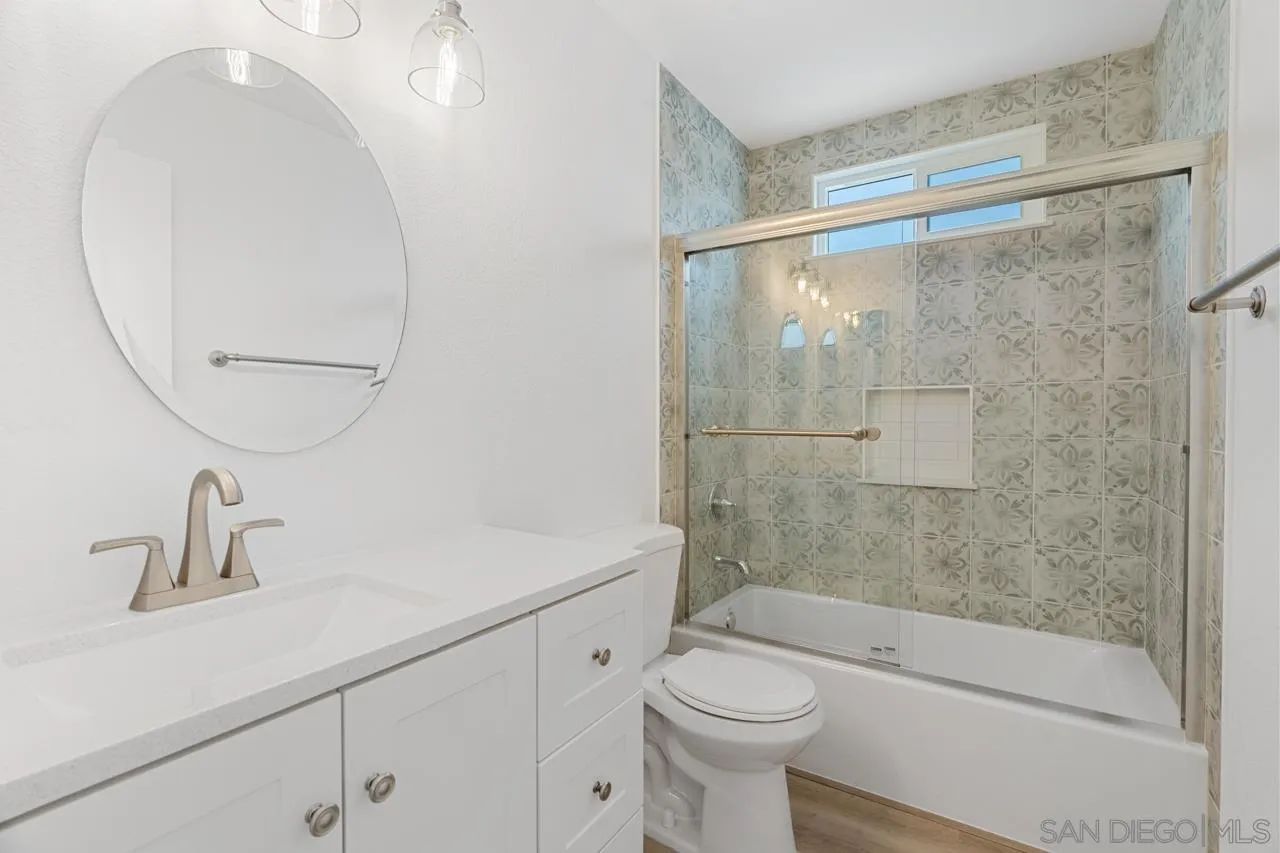1706 Catalpa Road Carlsbad, CA 92011 - Photo 21 of 41 a bathroom with a sink a toilet and shower