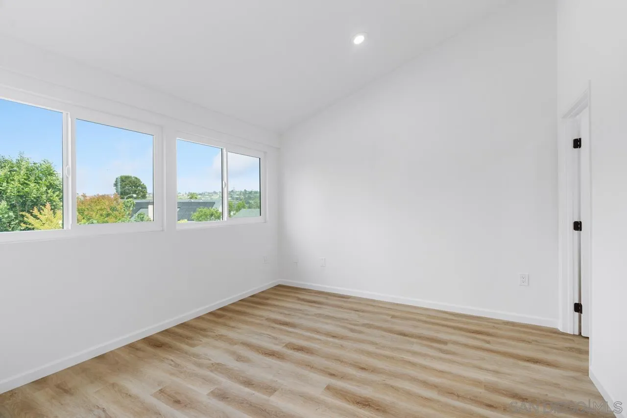 1706 Catalpa Road Carlsbad, CA 92011 - Photo 25 of 41 a view of room with window and wooden floor
