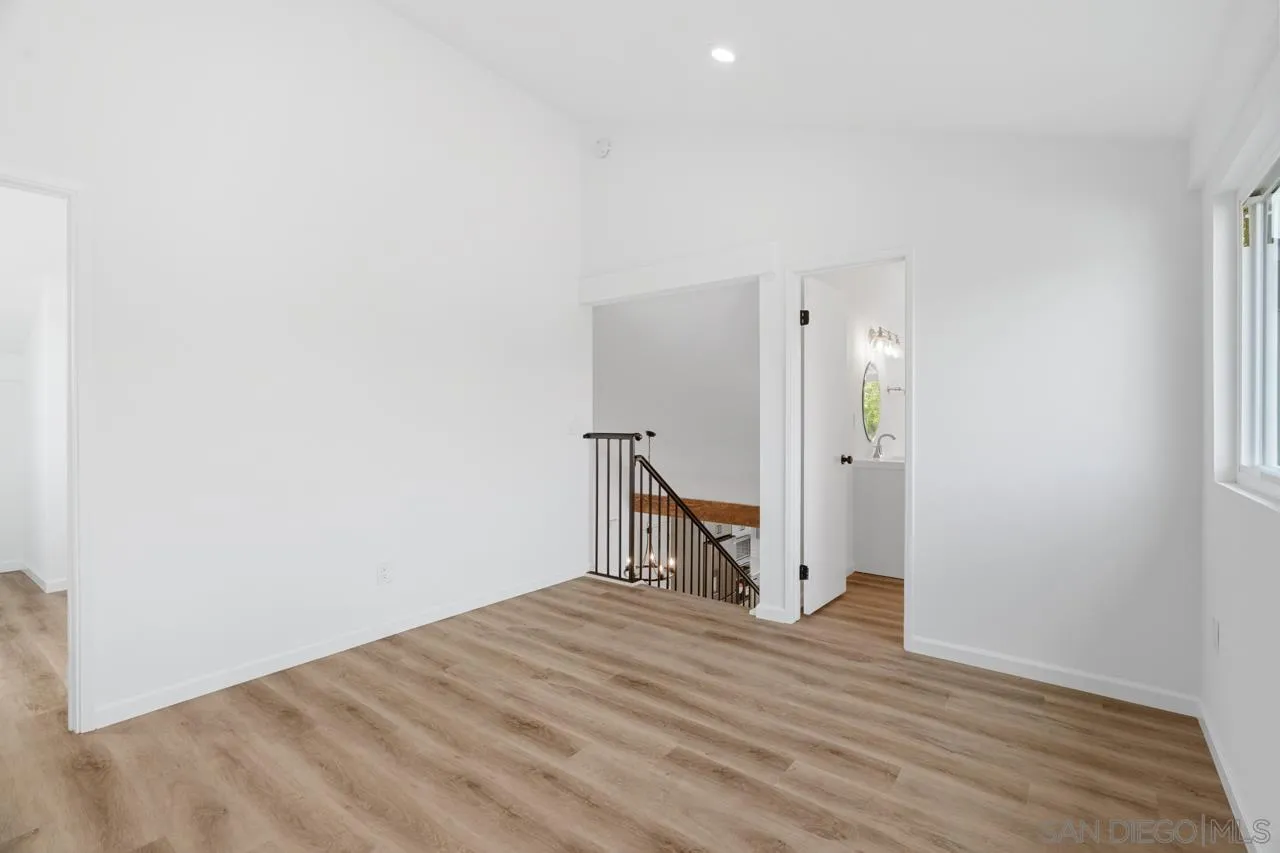1706 Catalpa Road Carlsbad, CA 92011 - Photo 27 of 41 a view of empty room with wooden floor
