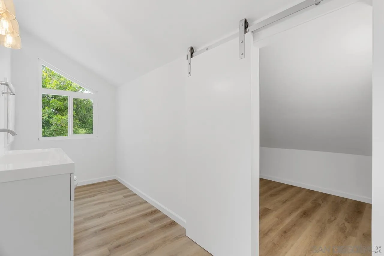 1706 Catalpa Road Carlsbad, CA 92011 - Photo 28 of 41 a view of small space with wooden floor and windows