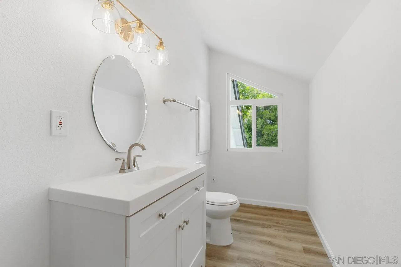 1706 Catalpa Road Carlsbad, CA 92011 - Photo 30 of 41 a bathroom with a sink and a mirror