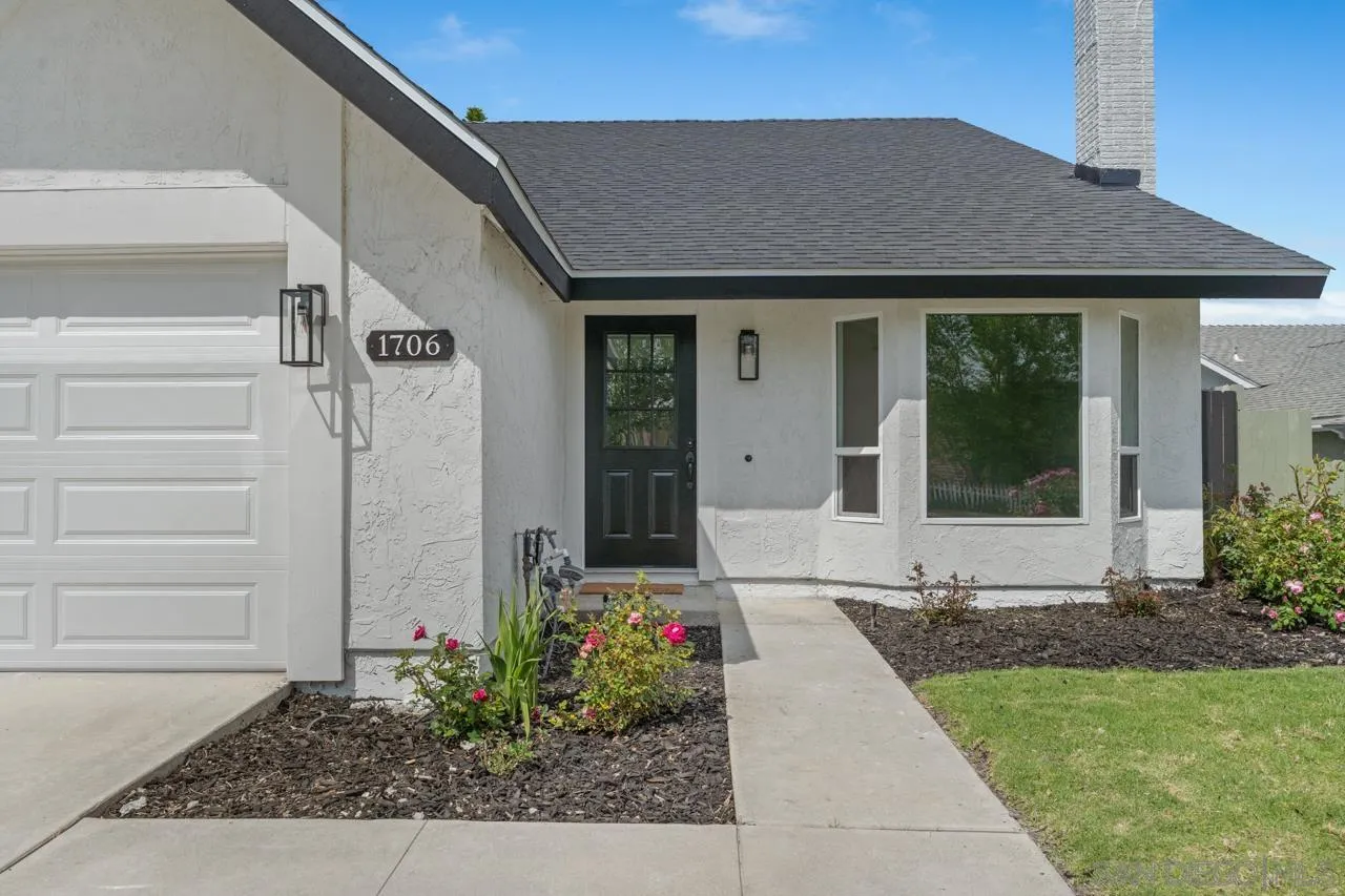 1706 Catalpa Road Carlsbad, CA 92011 - Photo 3 of 41 a front view of a house with a yard