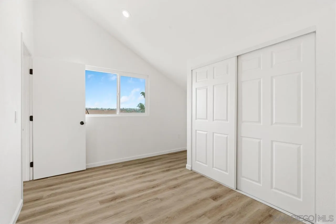 1706 Catalpa Road Carlsbad, CA 92011 - Photo 33 of 41 a view of an empty room with wooden floor