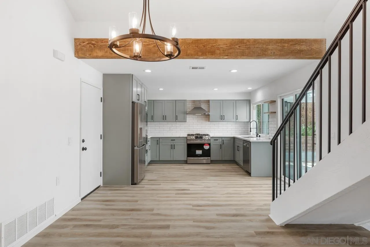 1706 Catalpa Road Carlsbad, CA 92011 - Photo 7 of 41 a view of a kitchen with a sink and cabinets