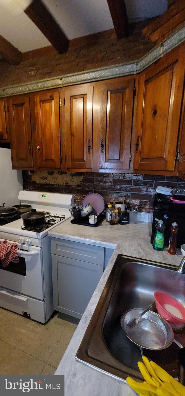 1357 North 10th Street Reading, PA 19604 - Photo 12 of 40 a kitchen with a sink and cabinets