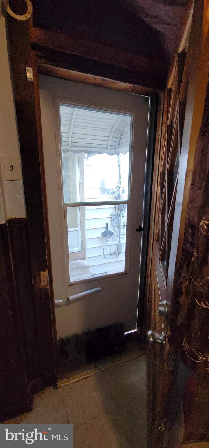 1357 North 10th Street Reading, PA 19604 - Photo 14 of 40 a view of an empty room with wooden floor and a window