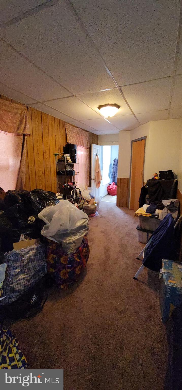 1357 North 10th Street Reading, PA 19604 - Photo 22 of 40 a living room with furniture and a flat screen tv