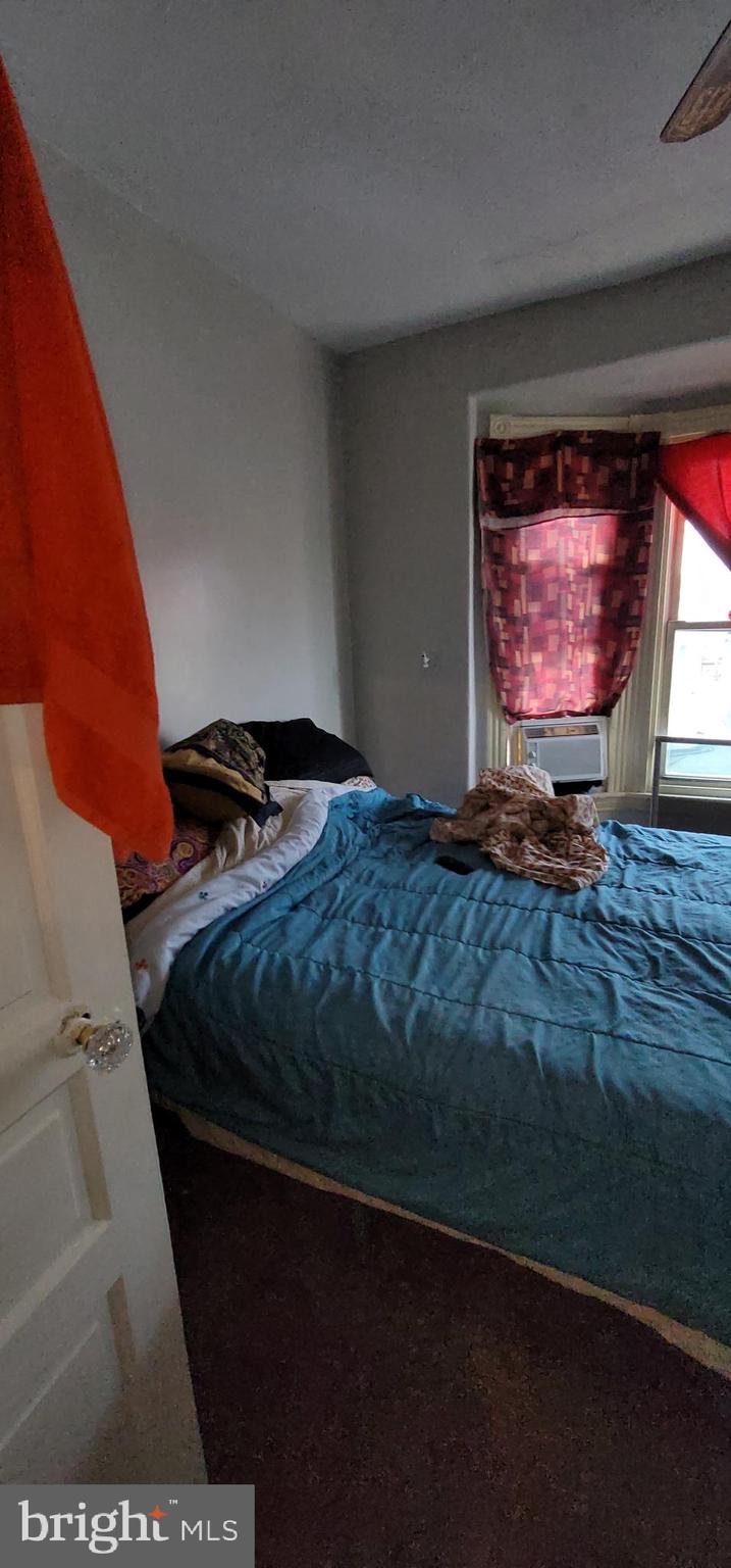 1357 North 10th Street Reading, PA 19604 - Photo 33 of 40 a bedroom with a bed and a window