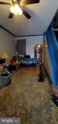 a living room with furniture and a piano