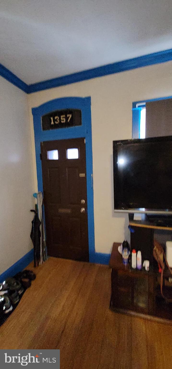 1357 North 10th Street Reading, PA 19604 - Photo 10 of 40 a room with furniture and flat screen tv