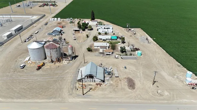a view of a terrace with lawn chairs