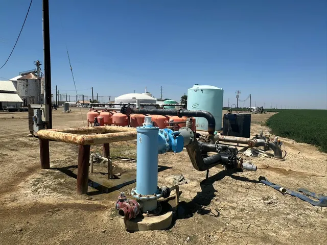 a view of swimming pool with outdoor seating and plants