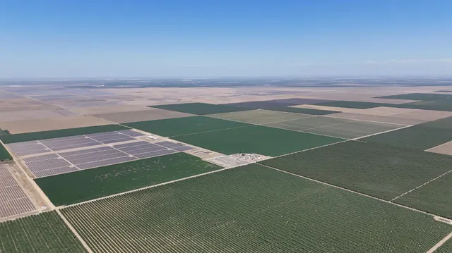 a view of a field with clear walls
