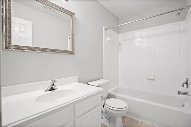 a bathroom with a sink a toilet and a bathtub