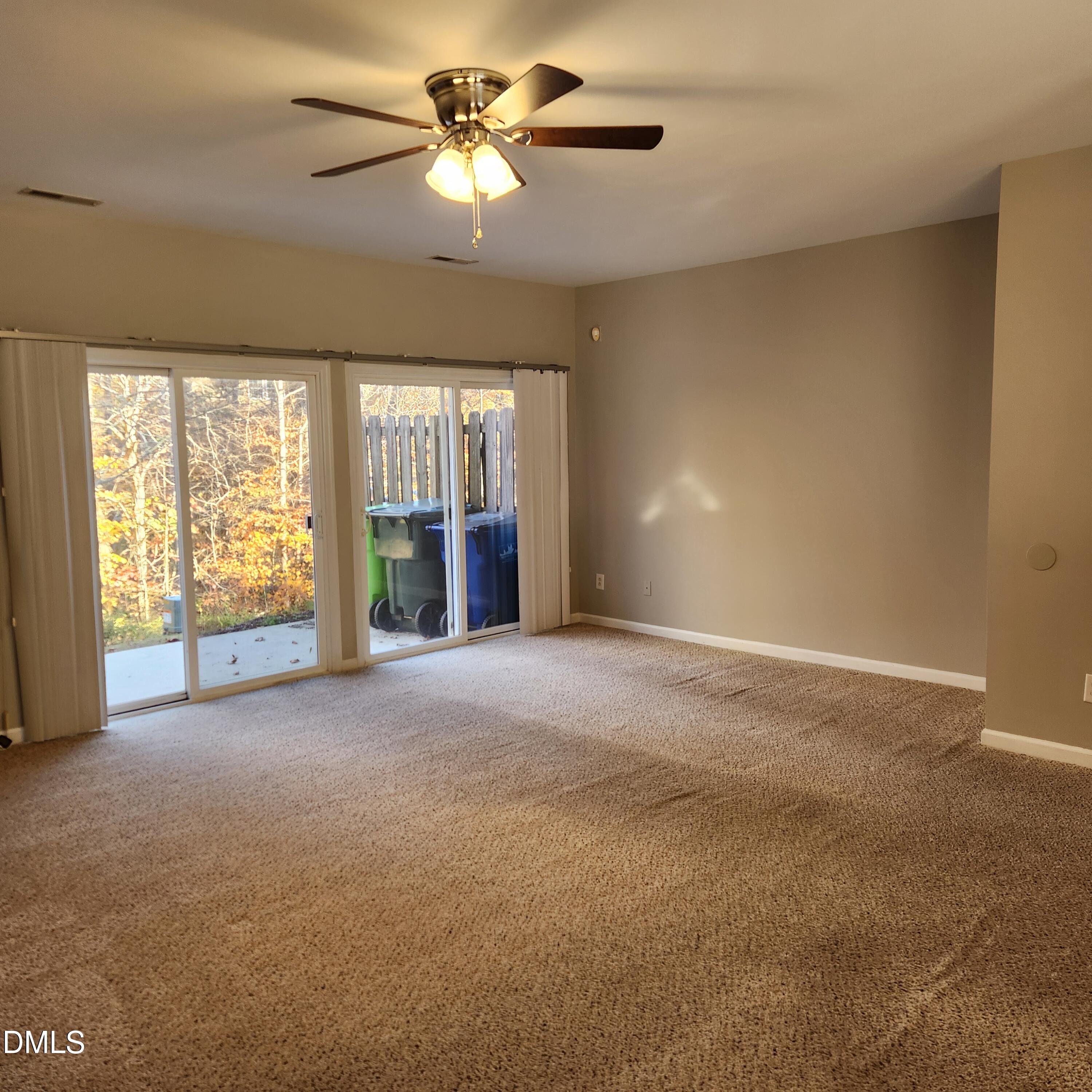 8212 Clasara Circle Raleigh, NC 27613 - Photo 12 of 20 a view of a big room with windows and chandelier fan