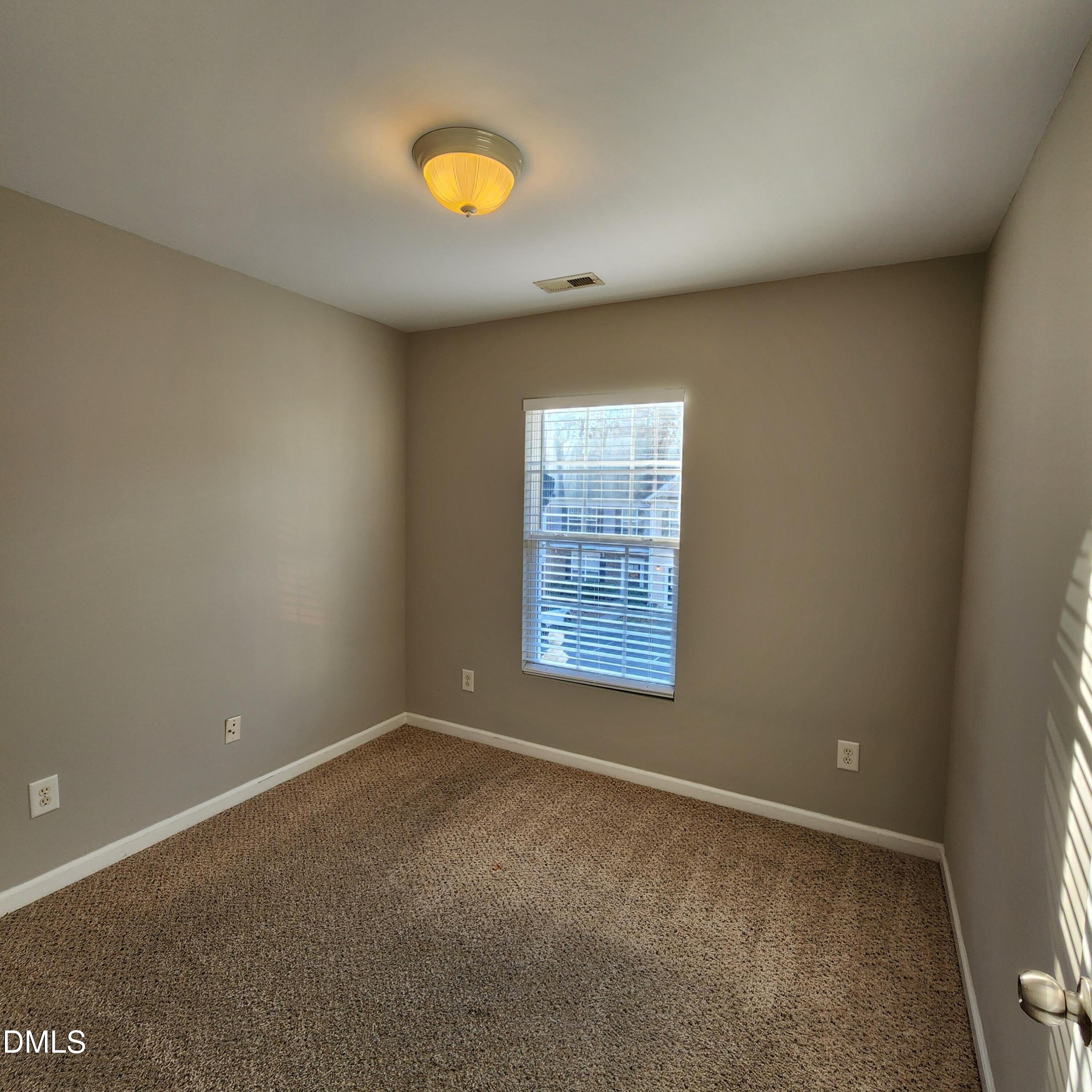 8212 Clasara Circle Raleigh, NC 27613 - Photo 20 of 20 an empty room with windows