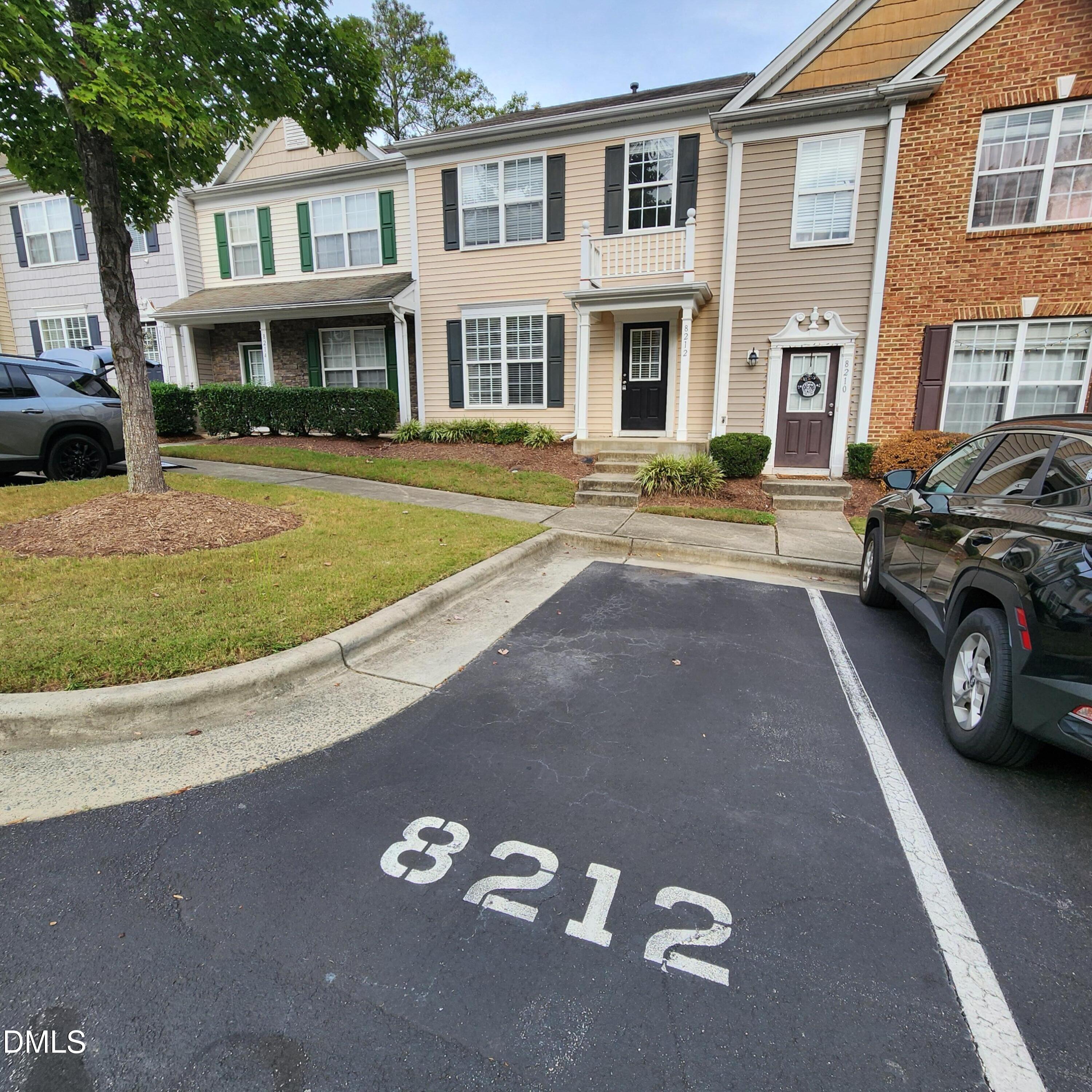 8212 Clasara Circle Raleigh, NC 27613 - Photo 3 of 20 a view of building with car parked