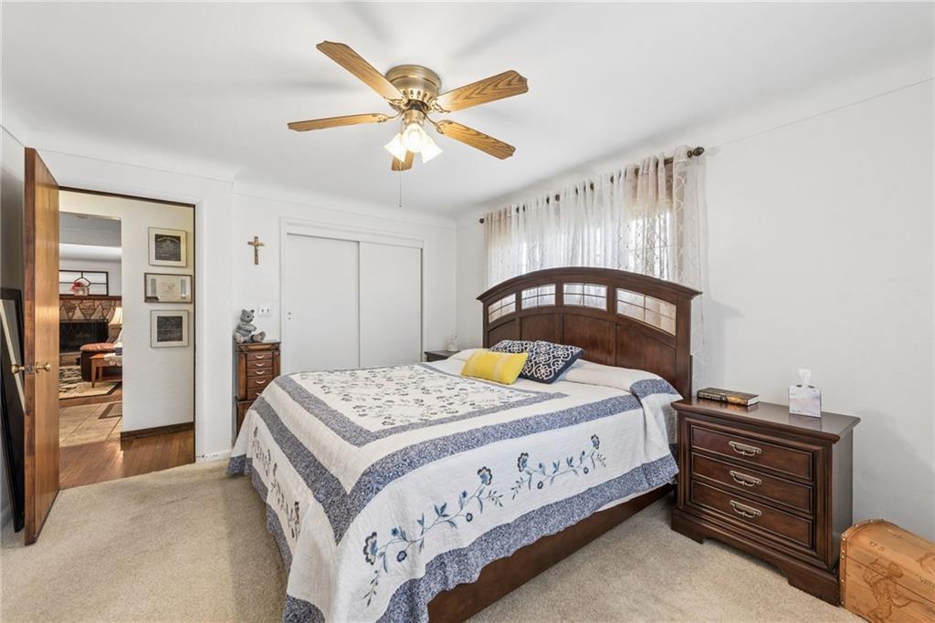 1824 Washington Road Apollo, PA 15613 - Photo 16 of 29 a bedroom with a bed and a chandelier
