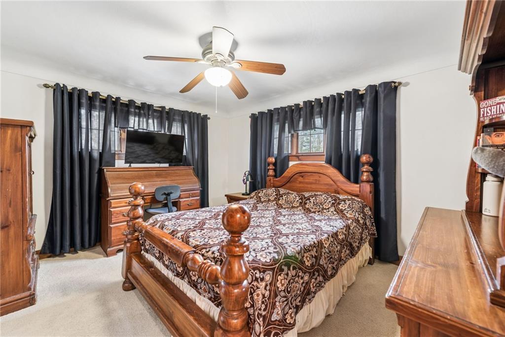 1824 Washington Road Apollo, PA 15613 - Photo 17 of 29 a bed room with a bed and a flat tv screen