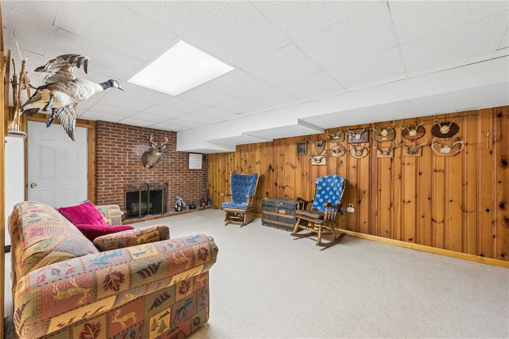 1824 Washington Road Apollo, PA 15613 - Photo 20 of 29 a living room with furniture gym equipment and a fireplace
